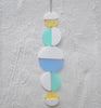 halves wall hanging - white and pastel